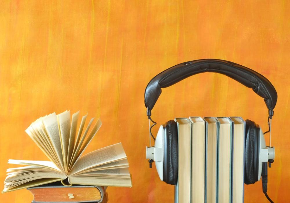 books and headphones on a desk